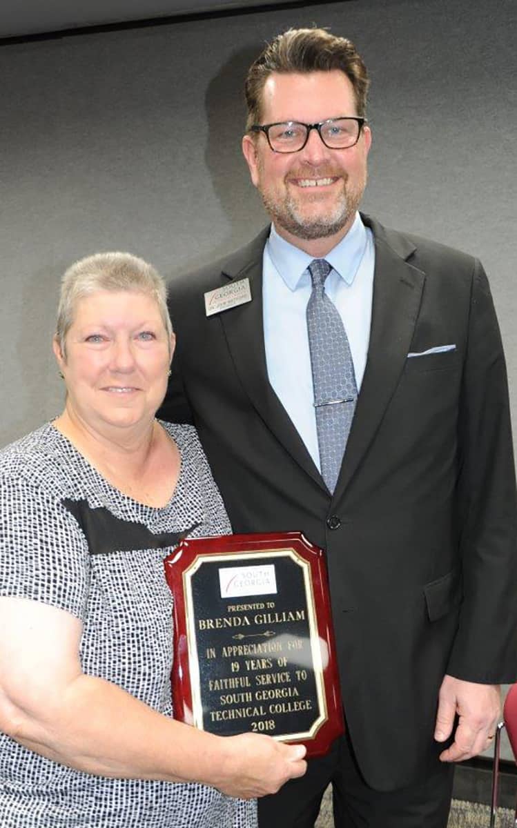 Brenda Butler Gilliam is shown above with South Georgia Technical College President Dr. John Watford after receiving her plaque at a special retirement party.