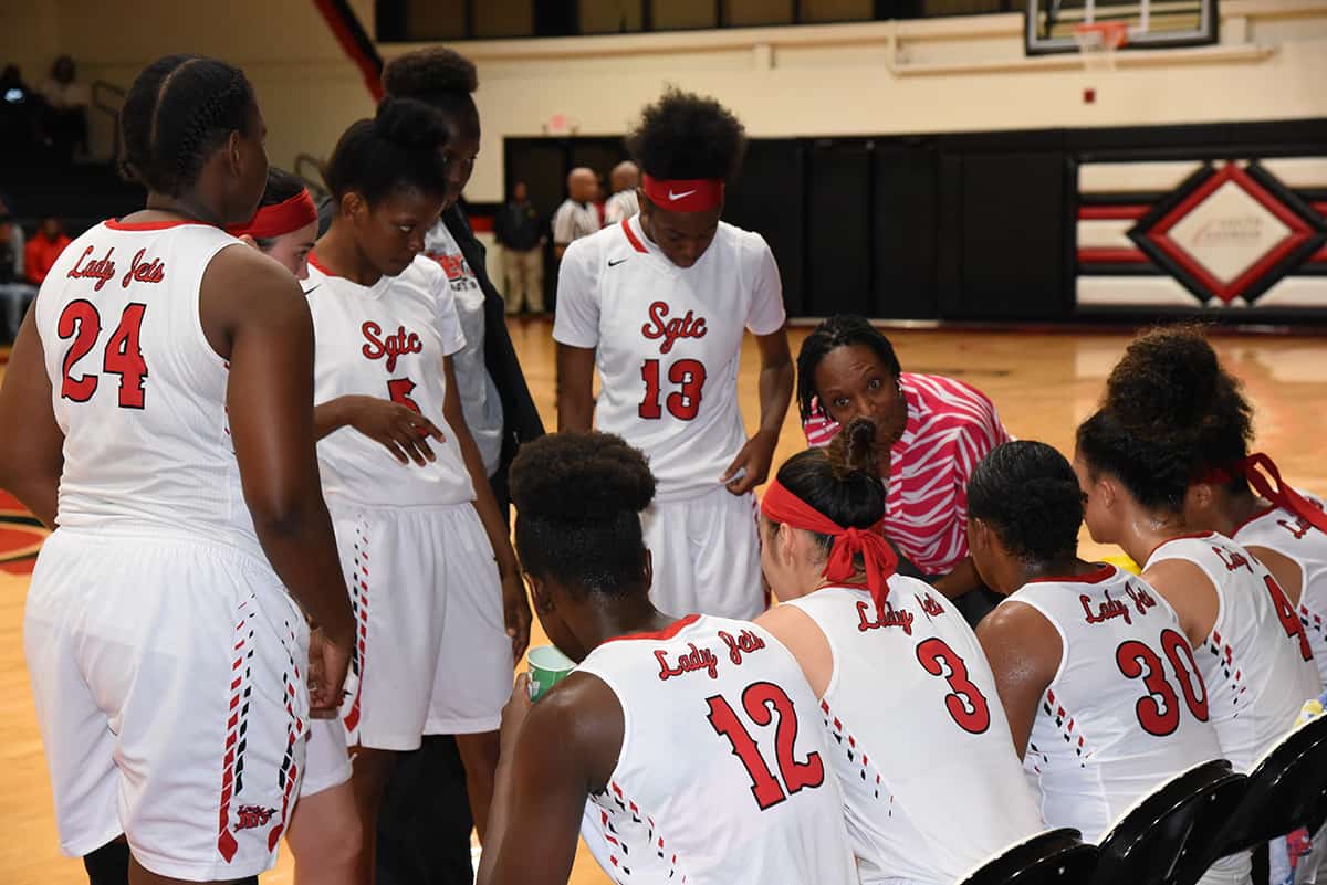 Assistant Coach Kenzia Conyers is talking to the Lady Jets during a time-out against Southern Crescent.