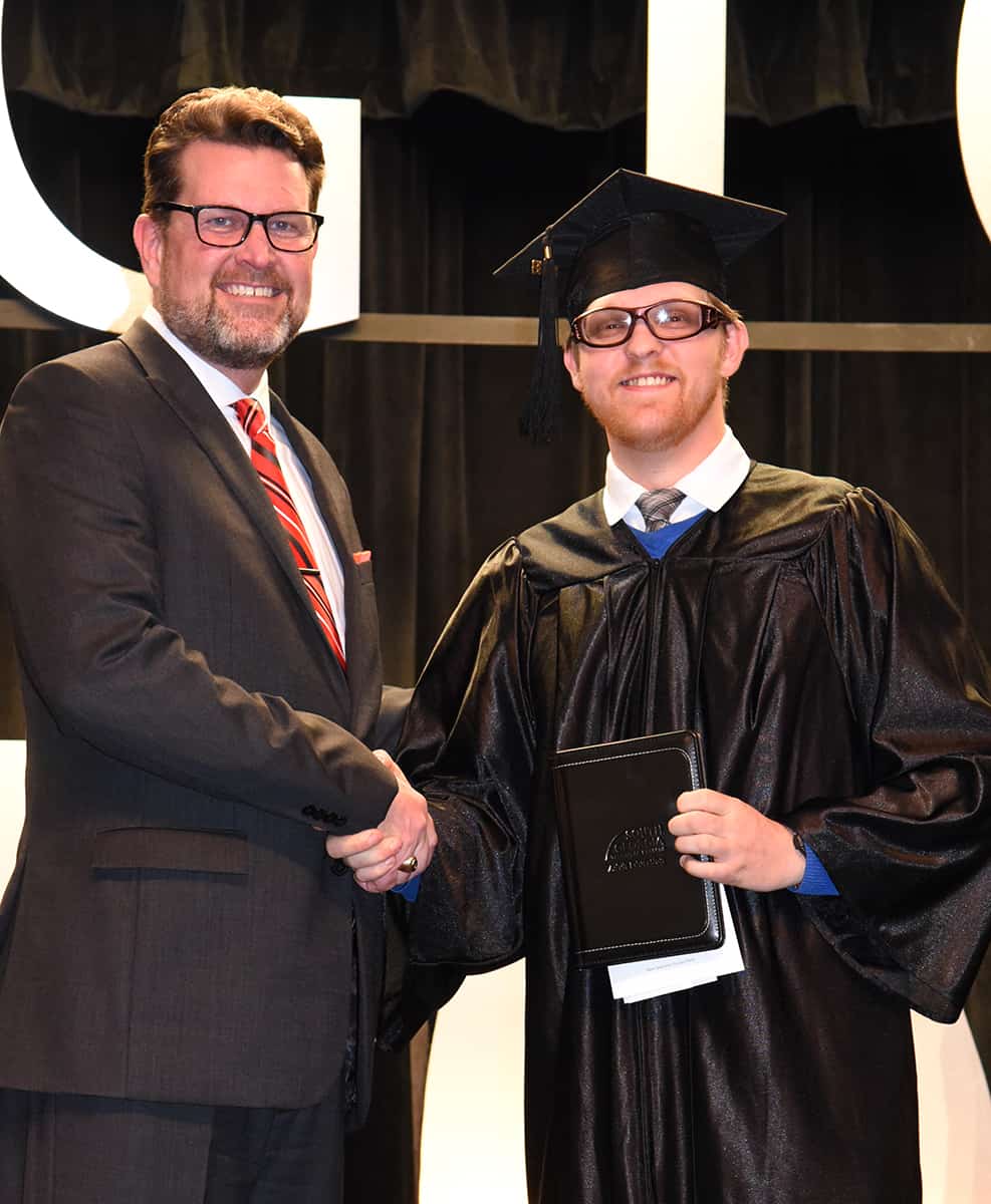 South Georgia Technical College President Dr. John Watford is shown above with the Fall 2018 GED Graduation Speaker Kaydon Wallis, who was also graduating with his GED at the ceremony.