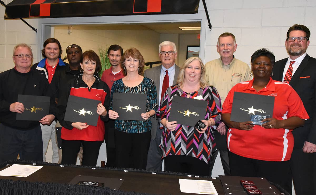 SGTC President Dr. John Watford is shown above (back row, far right) with the SGTC employees from the Americus campus who were reaching a milestone with the college this year. The employees from the Americus campus shown above are (l to r): Charles Christmas, Paul Fitzgerald, Starlyn Sampson, Gail Clary, Brandon Dean, Robin Bell, Raymond Holt, Teresa McCook, Mark Brooks and Mary Cross. Not shown are: Terri Battle, Deo Cochran, Lakenya Johnson, Brett Murray, Dr. Andrea Oates, Roy Statham, and Diana Skipper.