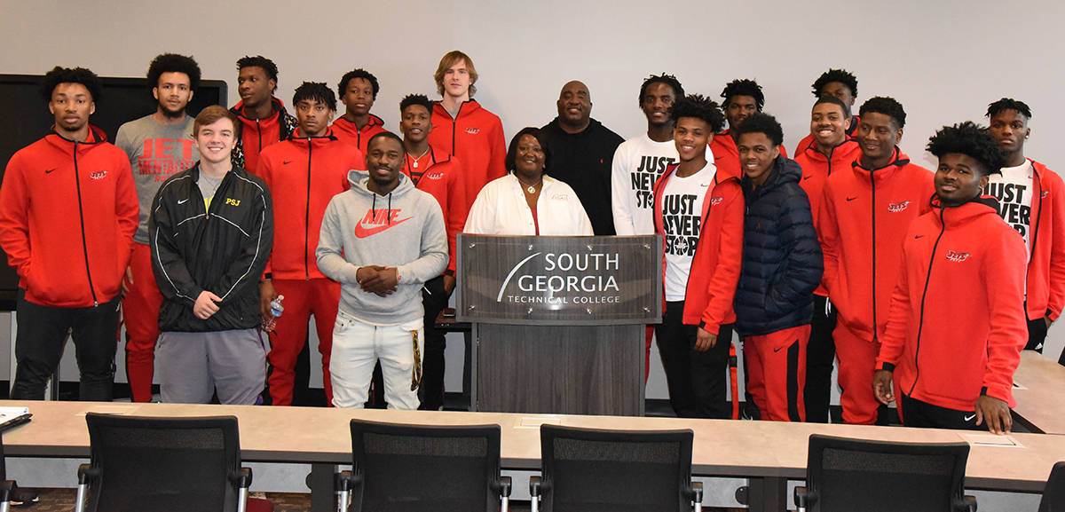 The South Georgia Tech Jets basketball team is shown above with Vincent Alston and SGTC Special Populations Coordinator LaKenya Johnson, who extended the invitation to Alston.