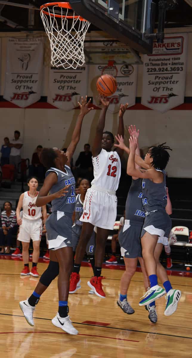 Fatou Poye, 12, goes up for two points to lead the Lady Jets in scoring in their win over Eastern Florida on New Year’s Eve in the Lady Jets Holiday Classic.