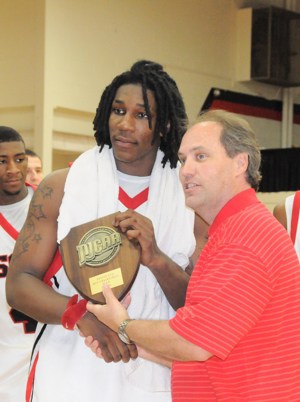 Courtesy of South Georgia Technical College - Jae Crowder receives the 2009 player of the year award from the Georgia Collegiate Athletic Association Commissioner David Elder while attending South Georgia Technical College.