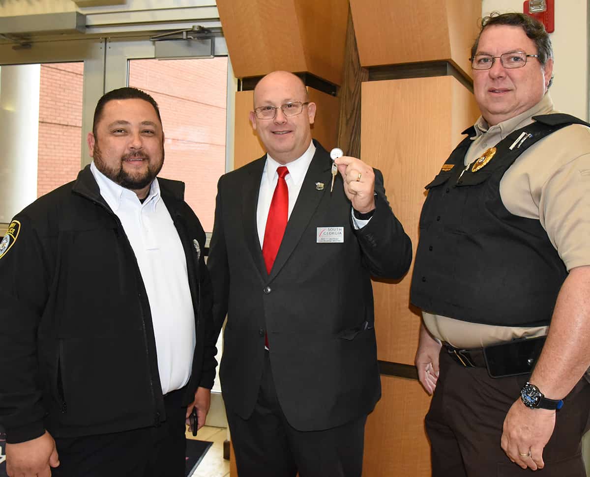 South Georgia Technical College Law Enforcement Academy Director Brett Murray (center) is shown above with Corporal Craig Fowler (left) and Captain James Buck (right) of the Perry Police Department presenting SGTC’s Murray with the keys to the donated vehicle for the SGTC Law Enforcement Academy training.