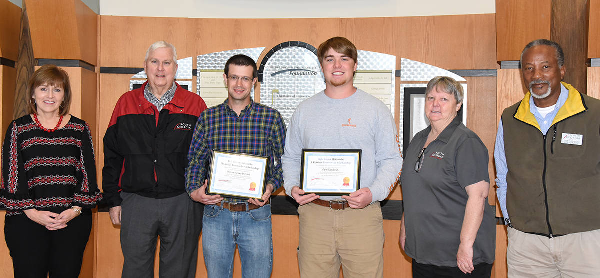 South Georgia Technical College Vice President of Economic Development (second from left) is shown above with SGTC Economic Development Assistant Tami Blount (l) with the Electrical Lineworker Kyle Glenn Holcombe Scholarship recipients Steven G. Parris and Zane Kendrick along SGTC Electrical Lineworker ¬¬instructors Sandra K. Royal and Sidney Johnson.