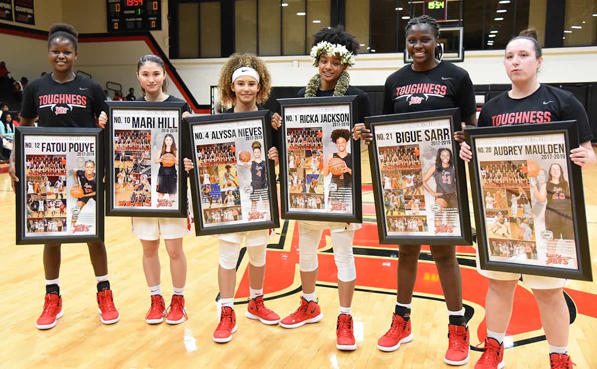 Lady Jets sophomores with their sophomore posters, Fatou Pouye, Mari Hill, Alyssa Nieves, Ricka Jackson, Bigue Sarr, and Aubrey Maulden