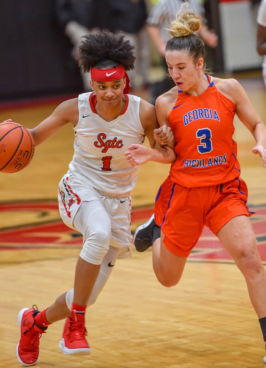 Ricka Jackson, 1, is shown above bringing the ball down the court against a Georgia Highlands player.