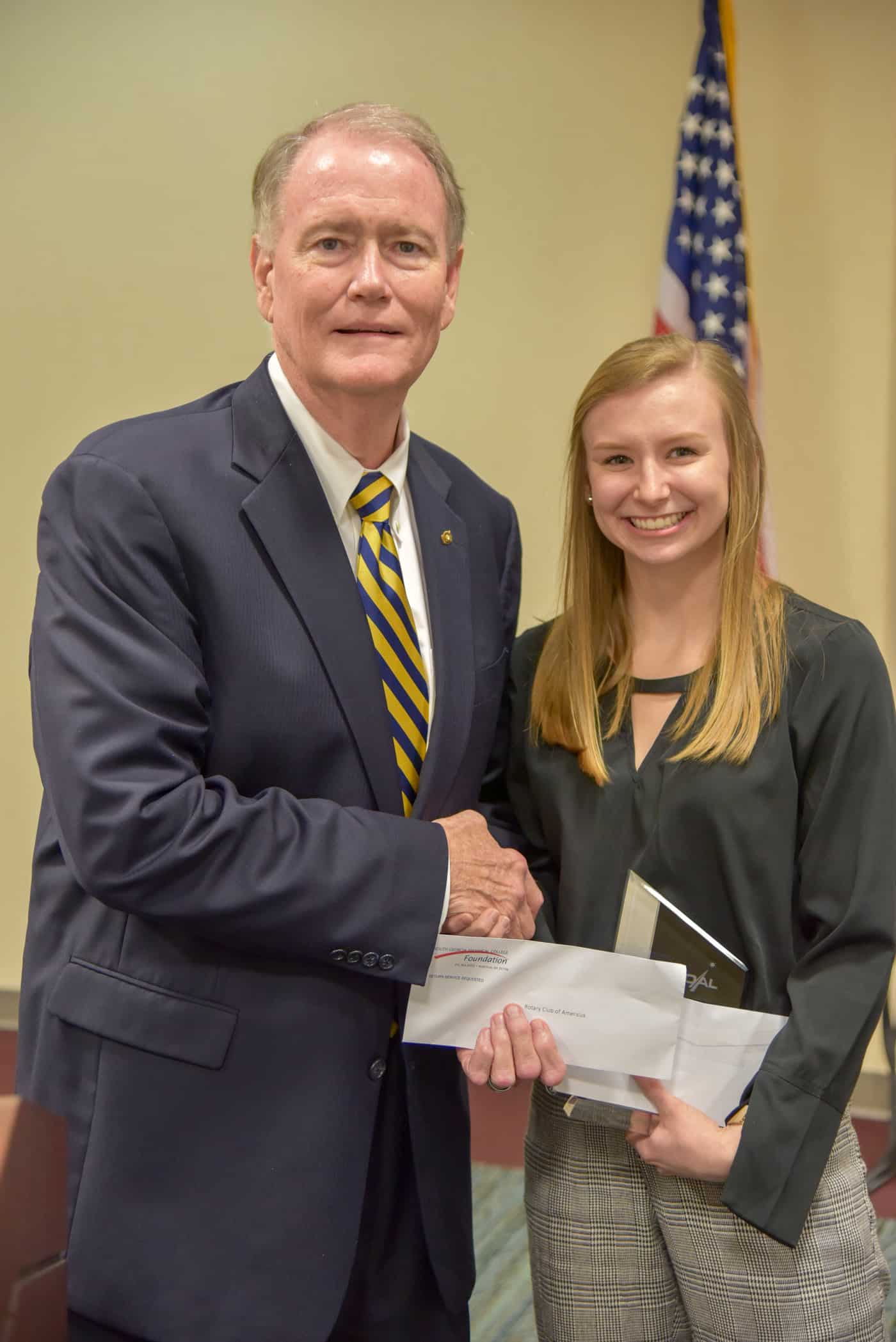 Americus Rotary Club Past President Don Smith (l) is shown above presenting a check to Kelsi Cannon(r), who was selected as the SGTC 2019 GOAL student of the year.