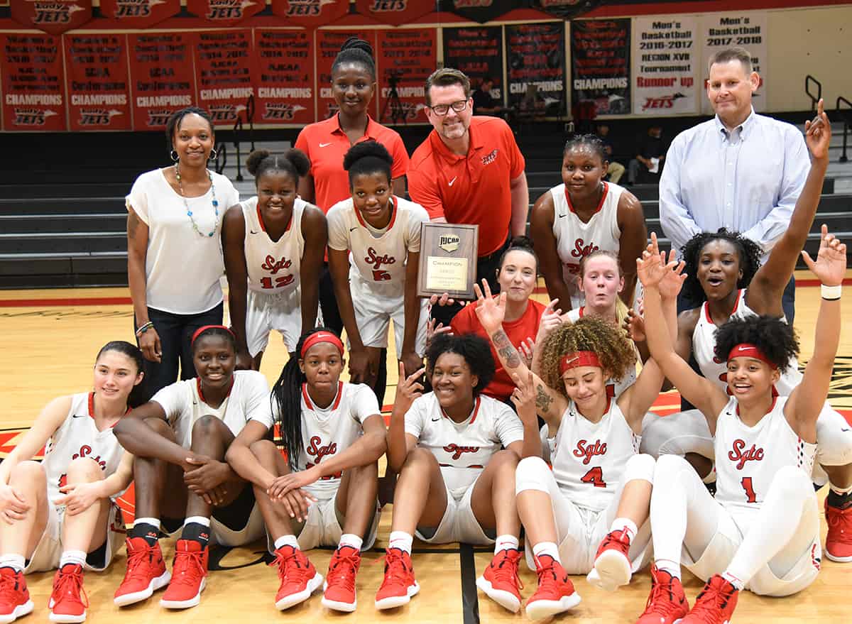 South Georgia Technical College President Dr. John Watford is shown above with head coach James Frey and assistant coach Kenzia Conyers and the 2018 – 2019 Lady Jets after they won the District J championship game against Spartanburg Methodist and earned the right to go to the NJCAA Division I National Tournament.