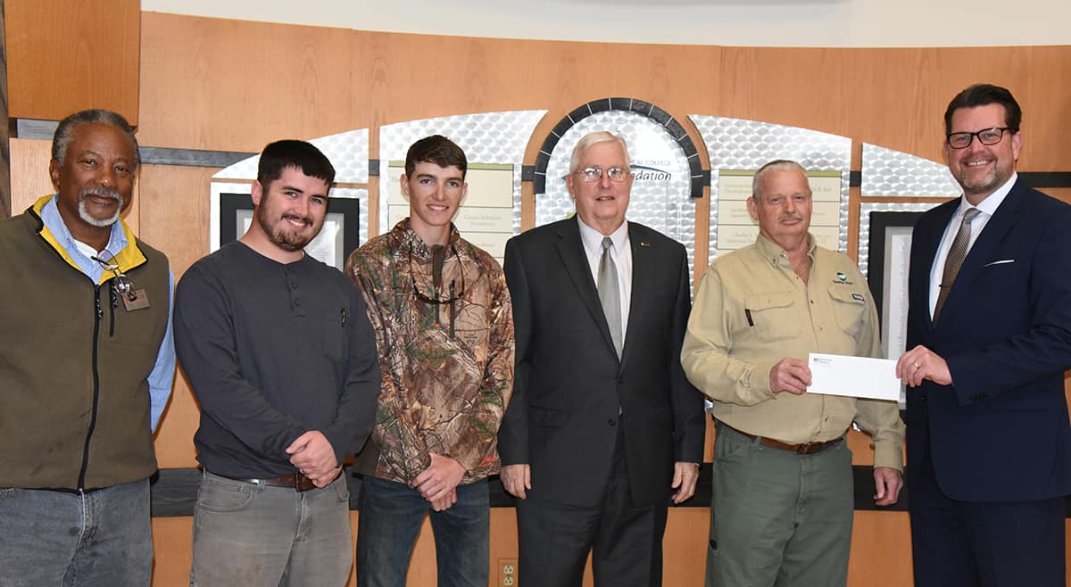 Danny Wingard of Sumter Electric Membership Corporation is shown above presenting a check from the Georgia EMC Foremen & Supervisors’ Association for scholarships to students in the SGTC Electrical Lineworker program to SGTC President Dr. John Watford. Also shown with Wingard (second from right) and Dr. Watford (far right) are South Georgia Technical College Electrical Lineworker Instructor Sidney Johnson, Electrical Lineworker students Justin Cooley of Monroe County, and Will Roberson of Butler Georgia, with SGTC Vice President of Economic Development Wally Summers.