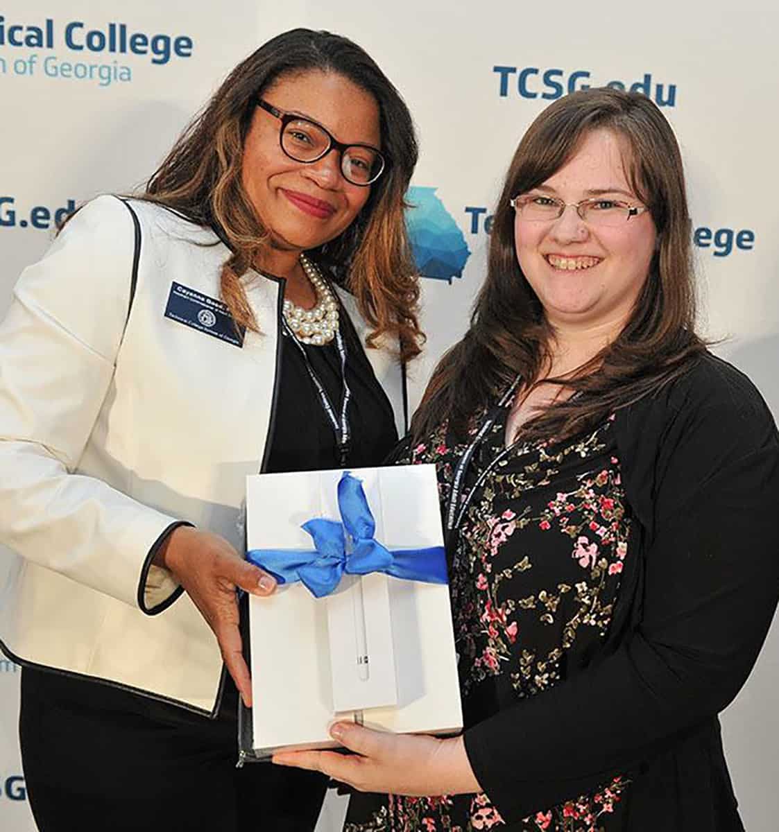 South Georgia Technical College’s EAGLE representative Heather Hinton of Oglethorpe is shown above receiving an IPAD from TCSG Assistant Commissioner for Adult Education Dr. Cavanna Good.