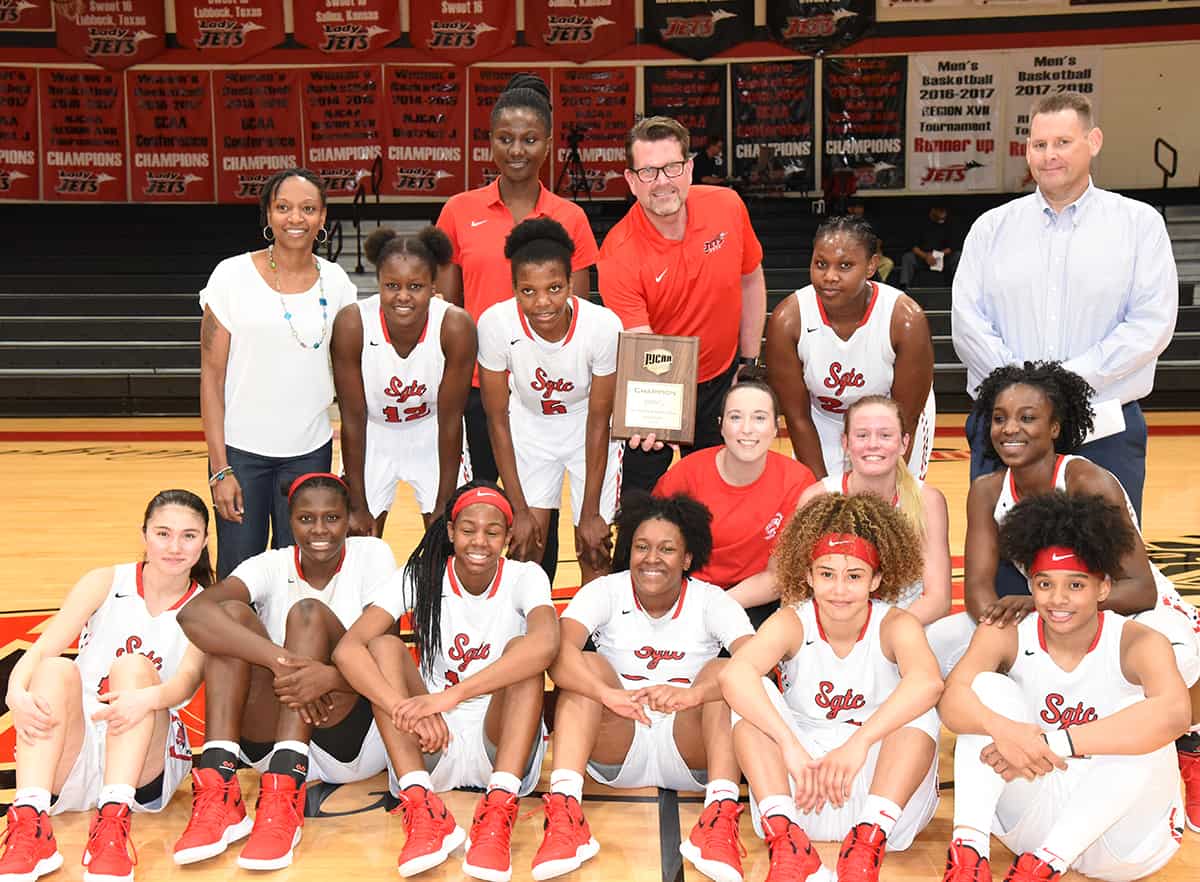 South Georgia Technical College President Dr. John Watford is shown above with head coach James Frey and assistant coach Kenzia Conyers and the 2018 – 2019 Lady Jets after they won the District J championship game against Spartanburg Methodist and earned the right to go to the NJCAA Division I National Tournament.