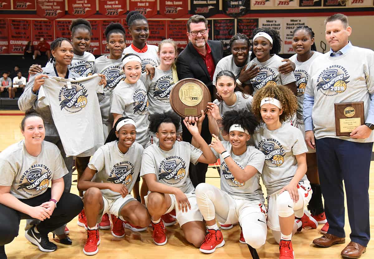 : South Georgia Technical College President Dr. John Watford is shown above with the 2018 – 2019 Region XVII Champion Lady Jets and head coach James Frey and Assistant Coach Kezia Conyers.