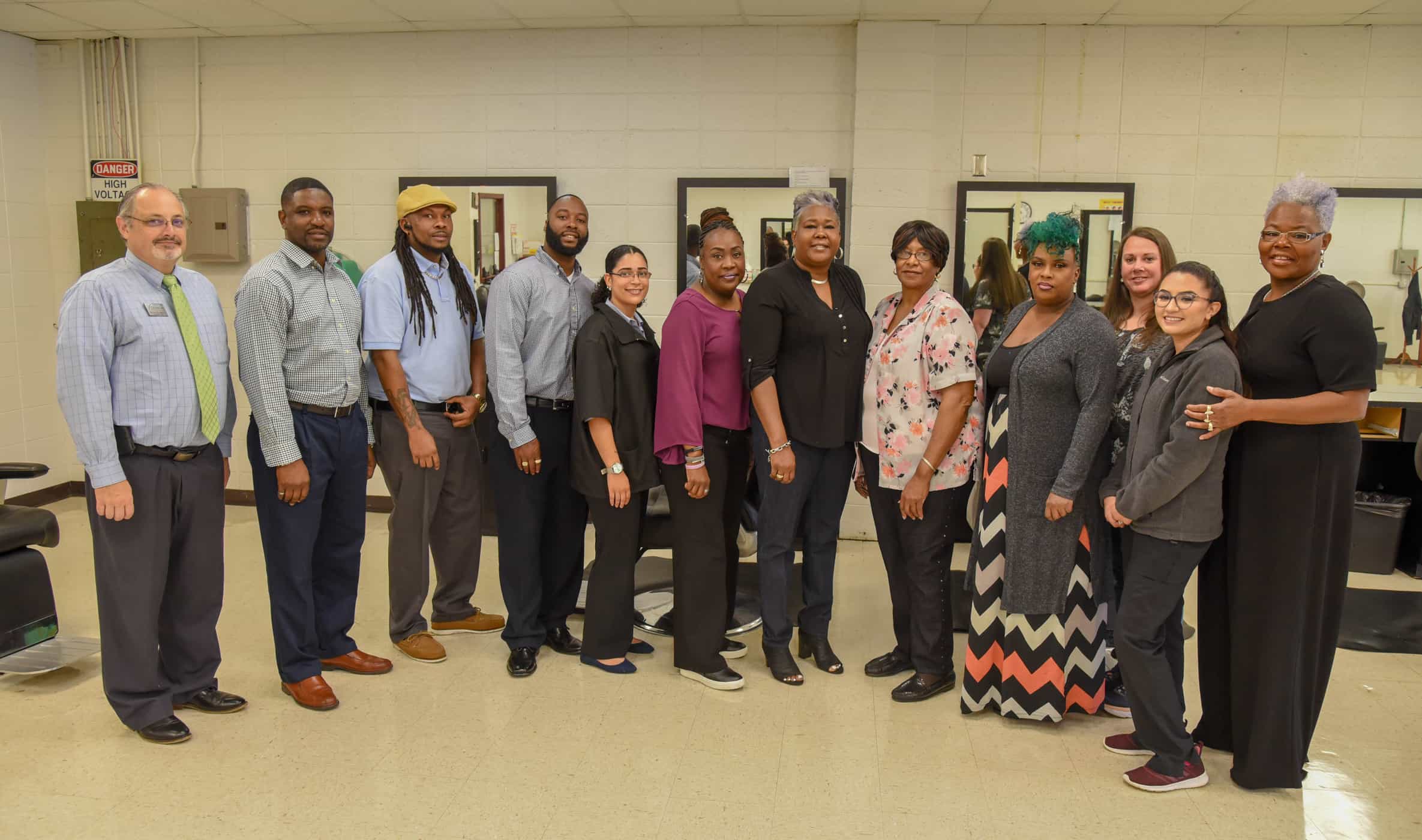 SGTC cosmetology and barbering advisory committee members stand together in the college's salon lab. Left to right: Dr. David Finley, Xavier Jackson, Adrain Hicks, Angelo Baisden, Anna Horton, Kembrial Harris, Tracy Finch,Martha Bruce, Armenta Battle, Danielle McSpadden, Yesenia Gutierrez and Dorothea Lusane-McKenzie.