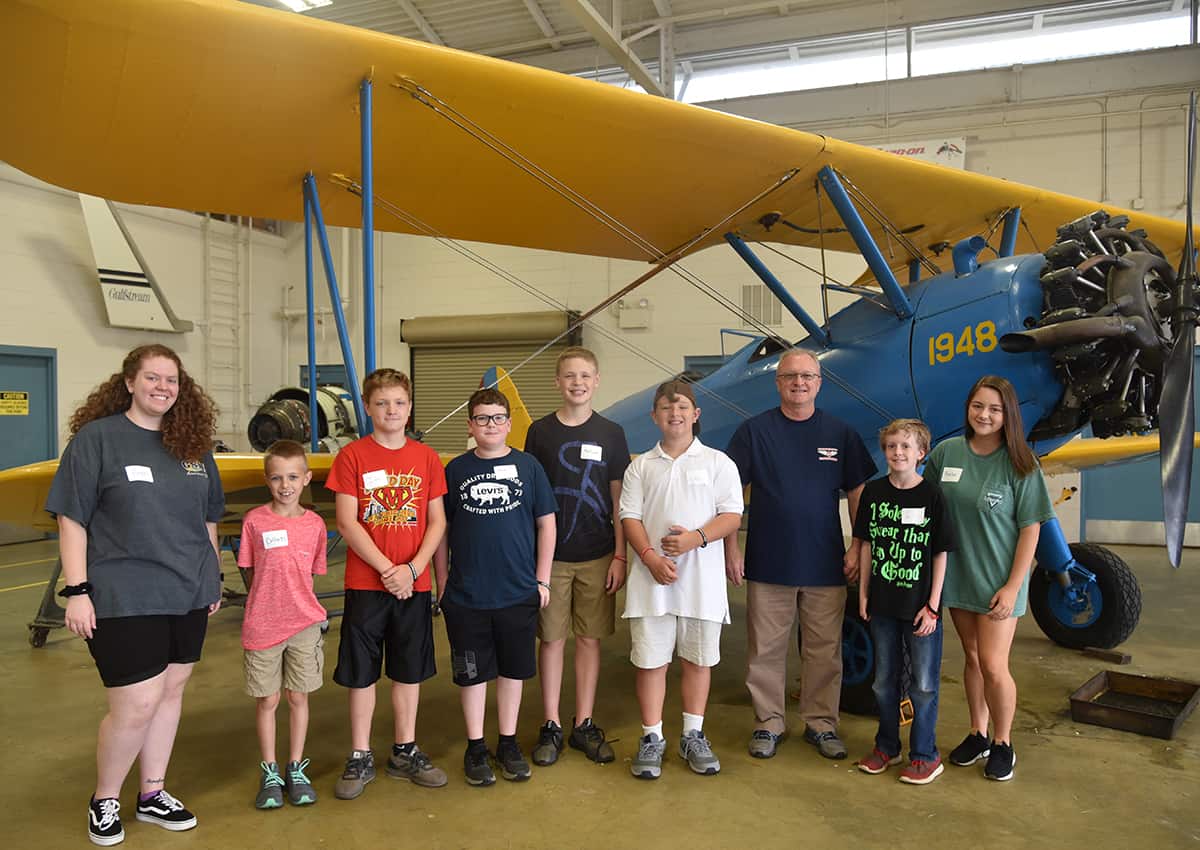 South Georgia Technical College Aviation Maintenance Instructor Charles Christmas (third from right) is shown above with some of the Sumter Historic Trust’s History Camp campers who toured the South Georgia Technical College Aviation Department as part of their camp activities. They are shown in front of SGTC’s Stearman bi-wing aircraft.