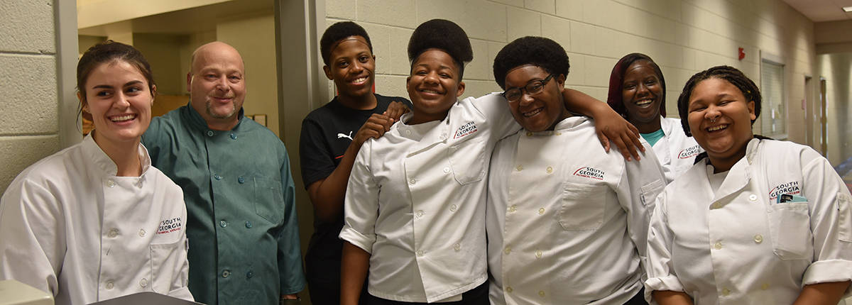 Shown above are a group of the SGTC culinary arts students with Chef “Ricky” Watzlowick getting ready for the restaurant project.