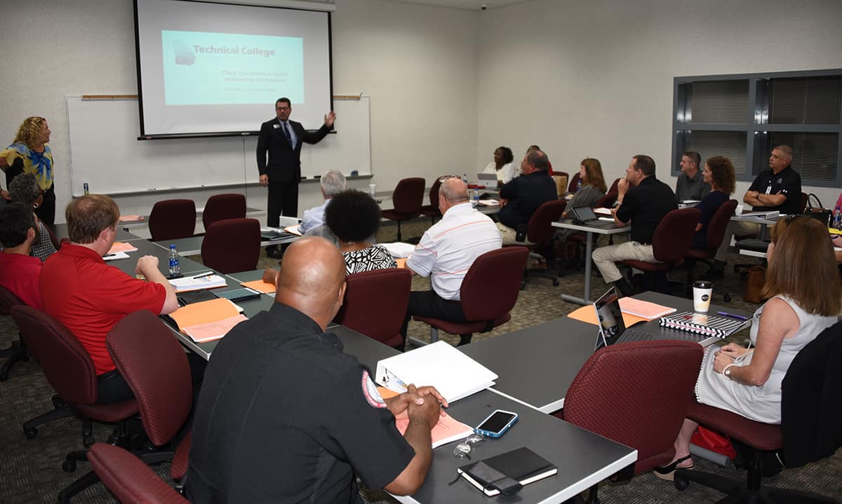 Jennifer Ziifle, TCSG Director of Campus Safety standing left) and South Georgia Technical College President Dr. John Watford (standing right) are shown above with individuals from Technical College across the state who attended the Leadership Symposium at the SGTC Crisp County Center campus.