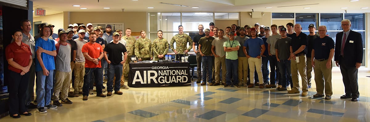 South Georgia Technical College aviation students and instructors are shown above with members of the Georgia Air National Guard in the Griffin B. Bell Aerospace Technology Center lobby.