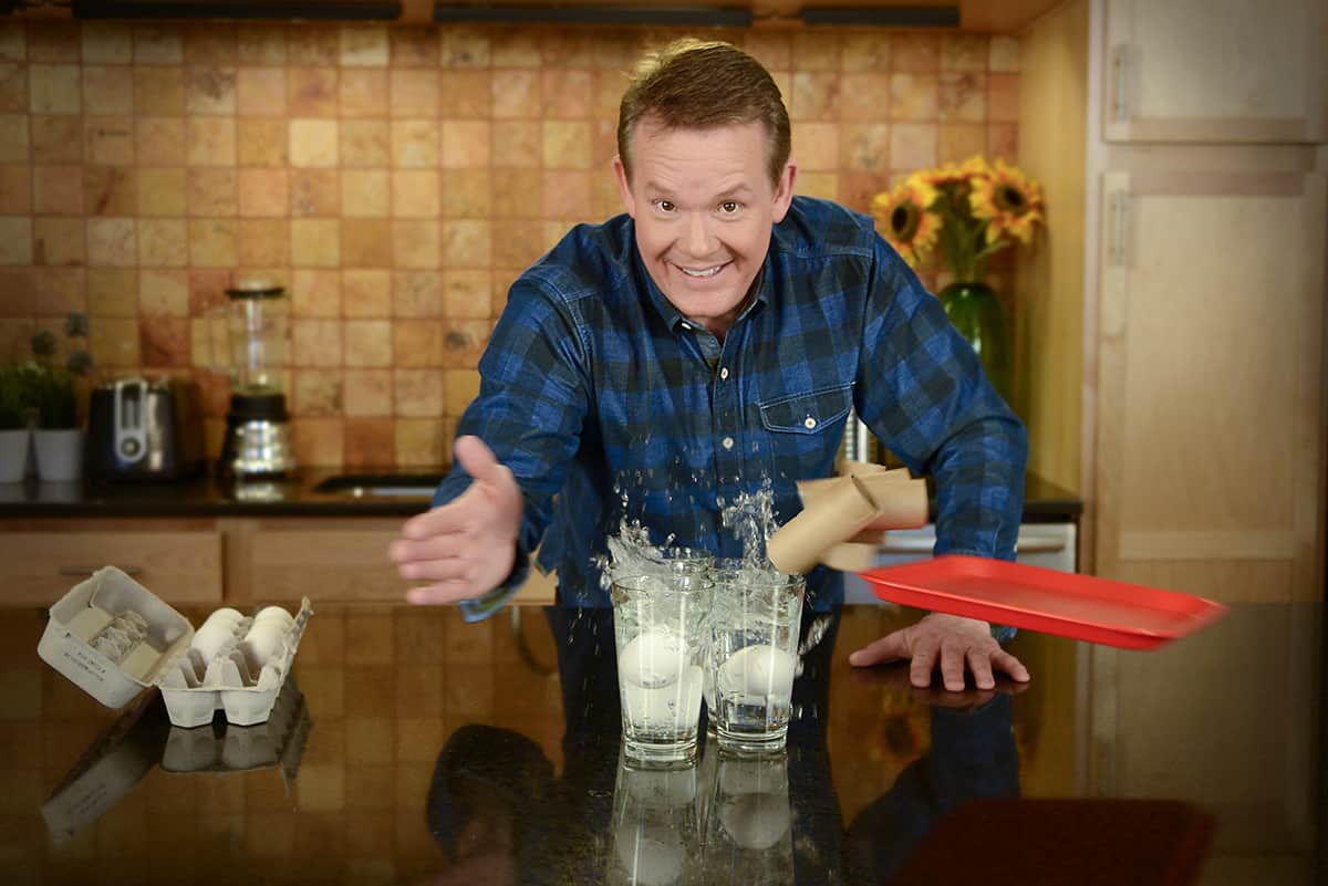 Steve Spangler is doing a science experience that involves dropping eggs into water without them breaking.