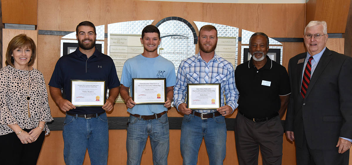 Shown above (l to r) are South Georgia Technical College Economic Development Assistant Tami Blount who works with the SGTC Electrical Lineworker program along with SGTC Electrical Lineworker Scholarship recipients Walker Meadows, Stanley Lowe, and Justin Jones. Also shown are Lineworker Instructor Sidney Johnson and SGTC Vice President of Economic Development Wally Summers.