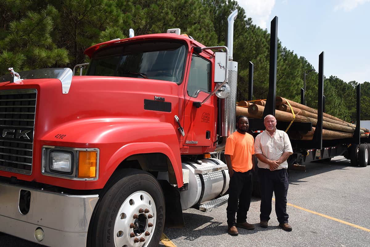 South Georgia Technical College Commercial Truck Driving Instructor Ken Hair is shown above with Demarious Hixson, Sr. who was the first driver to complete the SGTC new Log Truck Driver Safety Training program.