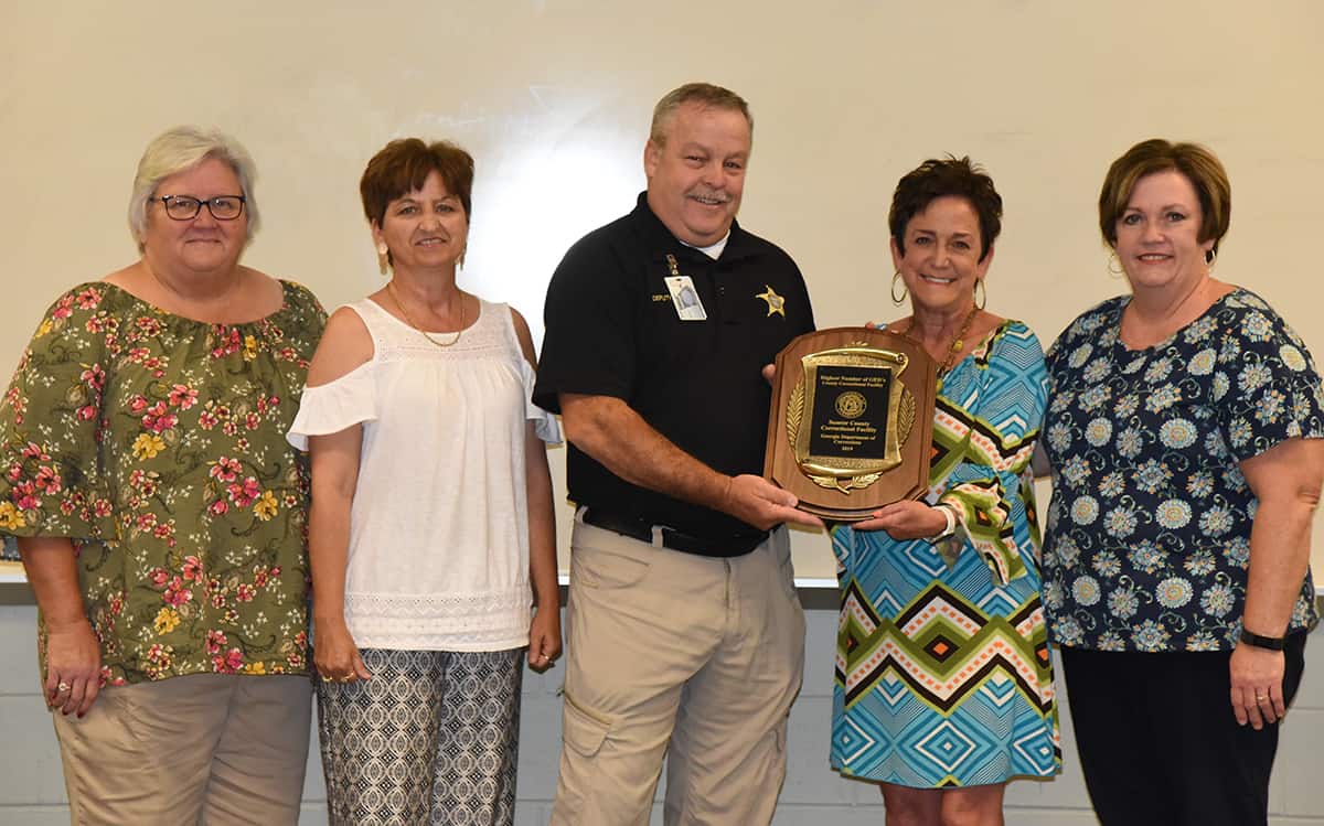 Shown above (l to r) are SGTC Adult Education instructors Cindy Bagwell and Tonya Visage who teach at the Sumter Correctional Institute along with Sumter Correctional Institute Deputy Warden James Murphy who is receiving the award from Lillie Ann Winn, SGTC Dean of Adult Education, and Lisa Truitt, SGTC Chief GED examiner. Not shown is Virginia Wilson, who is also an SGTC Adult Education instructor who teaches at Sumter Corrections.