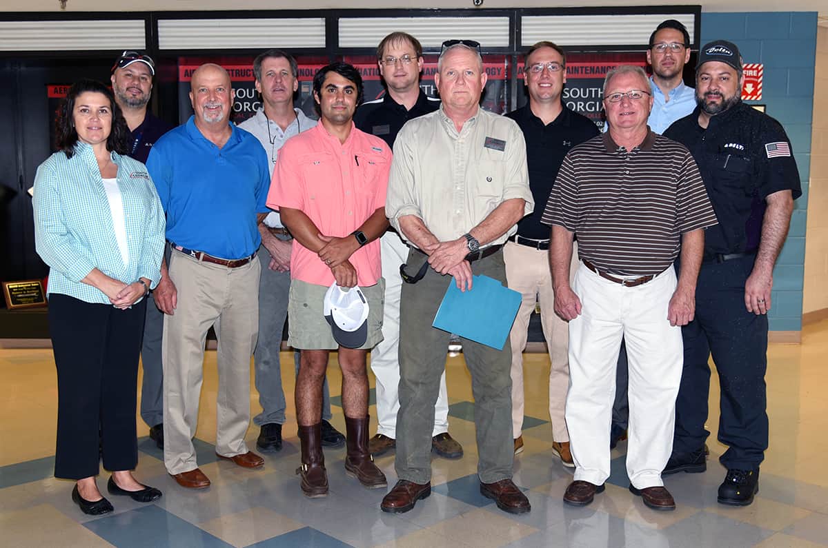 Pictured on the back row (l-r) are: Stephen Olas of Delta; SGTC Aviation Maintenance Instructor Paul Pearson; SGTC Aircraft Structural Instructor Jason Wisham; Eric Rojek of Thrush Aircraft; Alan Lanz and Lee Battista of Delta. On the front row (l-r) are: SGTC Aviation Maintenance Instructor Victoria Herron; Troy Payne of Delta; Patrick Humphrey of Souther Field Aviation; SGTC Aviation Maintenance Instructors David Grant and Charles Christmas.