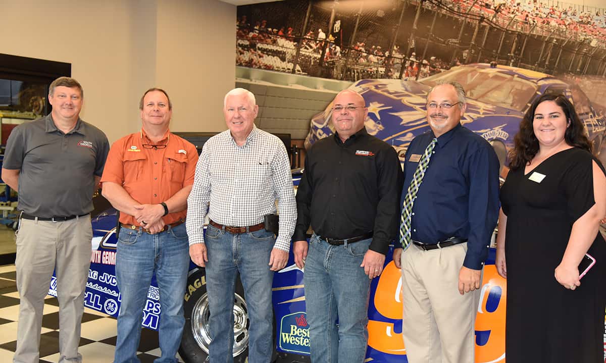 South Georgia Technical College Motorsports Vehicle Technology Instructor Kevin Beaver is shown above with members of his Advisory Committee in front of the college’s Aarons Rents #99 Race Car in the Motorsports Vehicle Technology show room. Shown (l to r) are Kevin Beaver, Ron Peacock, John Beaver, Hal Fowler, and SGTC Academic Dean Dr. David Finley, and SGTC Administrative Assistant for Academic Affairs April Hillard.