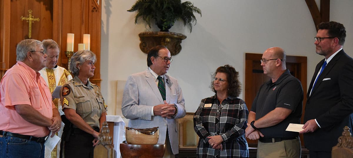 Paul Johnson, Father Jim Parker, and Sharon Smith Johnson are shown above (l to r) as Judge George Peagler is shown above presenting a scholarship donation from Saint John’s Anglican Church of Americus in memory of Nicholas Smarr and Jody Smith to SGTC Law Enforcement Academy instructor and SGTC Assistant Vice President of Student Affairs Vanessa Wall, SGTC Law Enforcement Academy Director Brett Murray and South Georgia Technical College President Dr. John Watford for the South Georgia Technical College Foundation’s Smarr-Smith endowed scholarship.