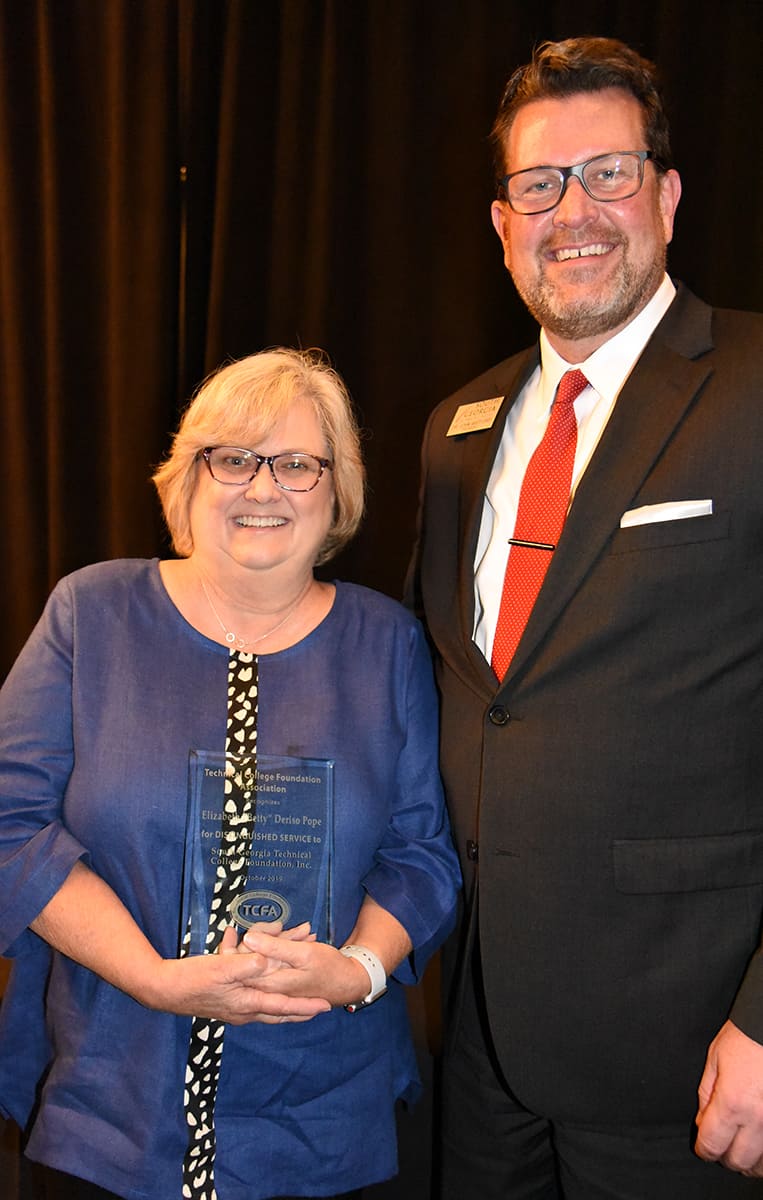 South Georgia Technical College President Dr. John Watford (right) is shown above with Kerri Post (left) who accepted the 2019 Distinguished Service Award on behalf of her mother at the Technical College System of Georgia Leadership Conference in Savannah recently.