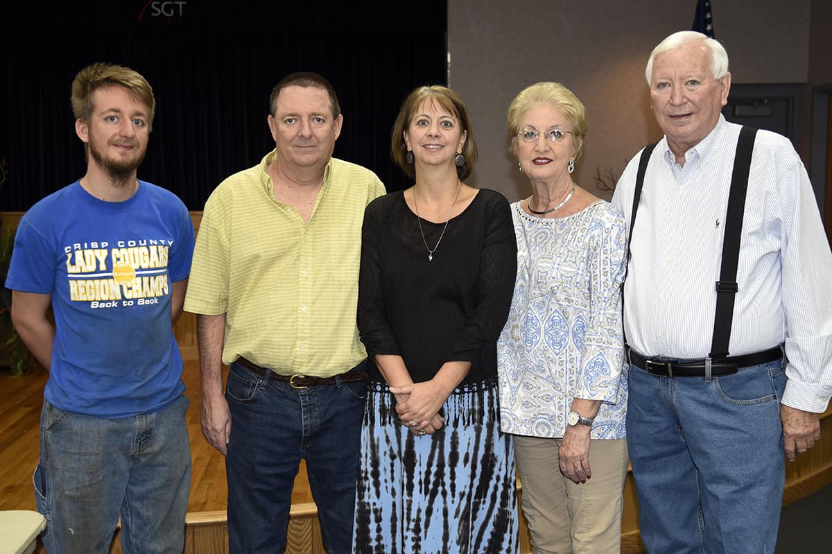 Retiring SGTC Math instructor Kim Miller (center) is pictured with her family (l-r): her son Andrew Miller, husband Robert Miller, and parents Melissa and Johnny Gordon.