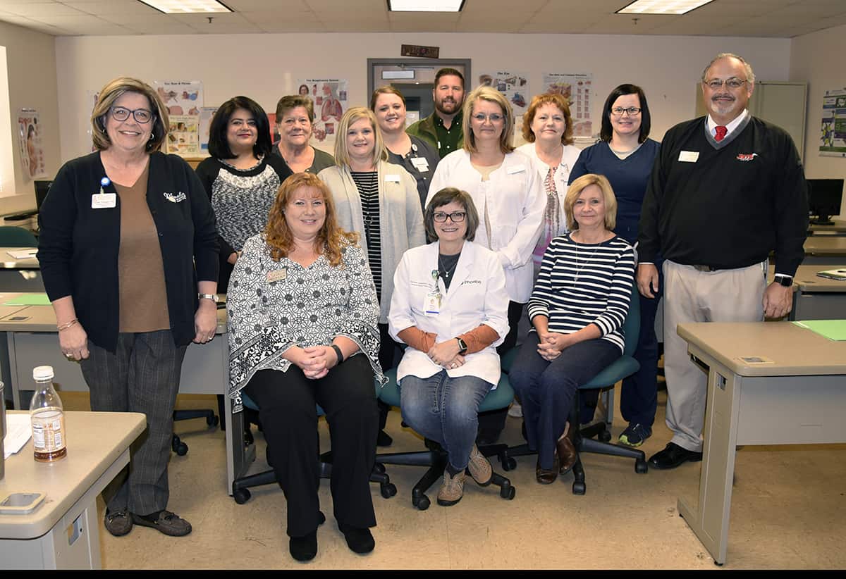 Pictured are members of the SGTC Practical Nursing advisory committee. Seated left to right are Jennifer Childs, Tammi Johnston, and Debra Mims. Second row (l-r): Susie Fussell, Sandhya Muljibhai, Christine Rundle, Shelley Gore, Kristi Hasty, Dr. David Finley. Third row (l-r): Debra Webb, Trina Murray, Chance McGough, Juanita Wells.