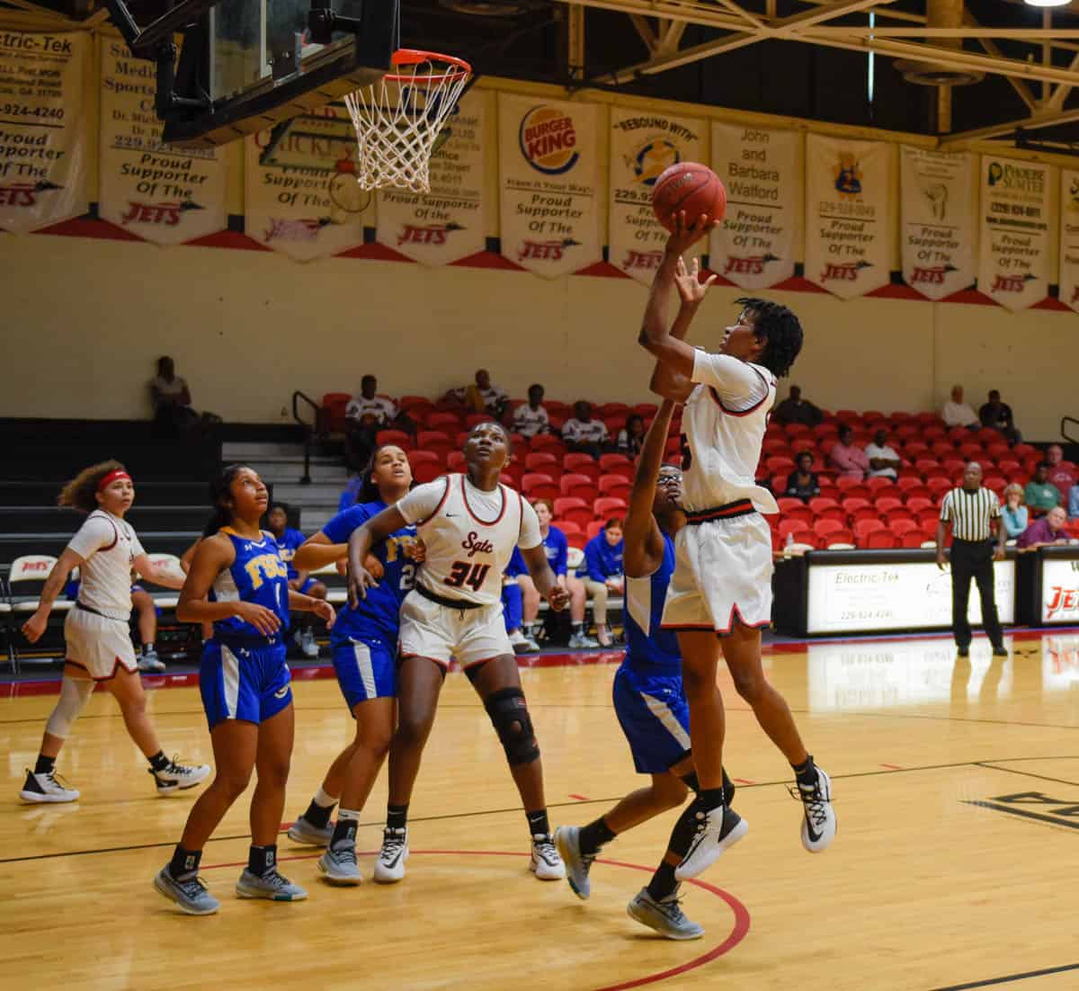 SGTC’s Amara Edeh (5) goes up for a basket against the team from Florida State College at Jacksonville.