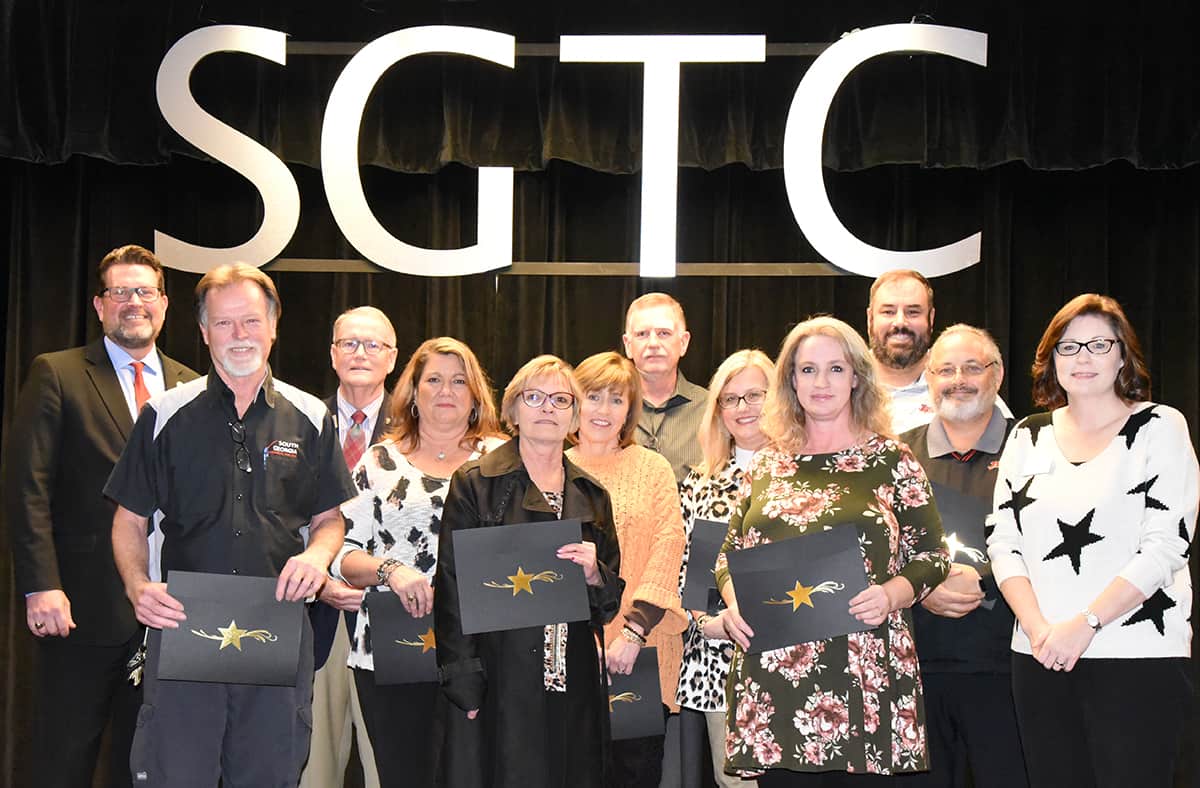 SGTC President Dr. John Watford is shown above (back row, far right) with the SGTC employees who were reaching a milestone with the college this year. The employees shown are: Jeff Wiseman, Don Smith, Karen Werling, Terri Smith, Tami Blount, Mark Brooks, Michele McGowan, Melissa Grantham, Chris Ballauer, and Dr. David Finley. SGTC Human Resource Director Sandy Larson is also shown with the group. Not shown are: Matthew Burks, Bob Cook, Audra Ekkel, Tonya Visage, Kevin Beaver, Victoria Herron, Katrice Taylor, Sammy Stone, Mike Enfinger, Randy Greene, and Dr. Deborah Jones.