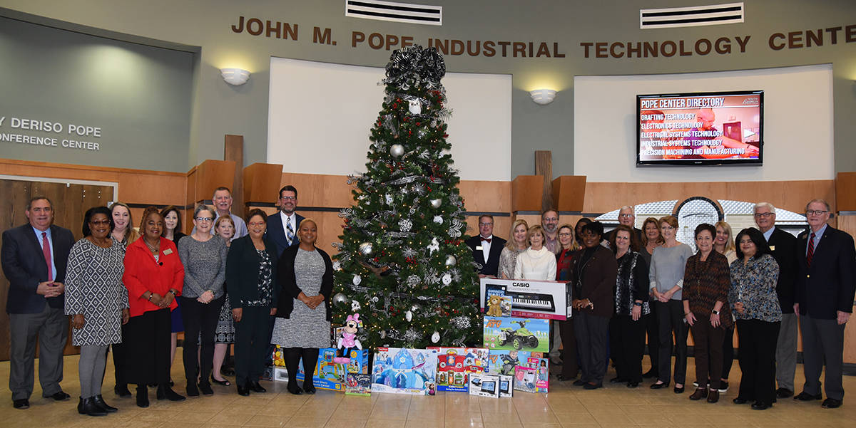 Members of the South Georgia Technical College’s Presidential Cabinet are shown above in front of the college’s Christmas tree in the John M. Pope Center on the Americus campus with many of the items that were donated for the Governor’s and Georgia Division of Family and Children Services “Secret Santa” program. Every division of the college participated in the “Secret Santa” program and these individuals are a representative of those groups.