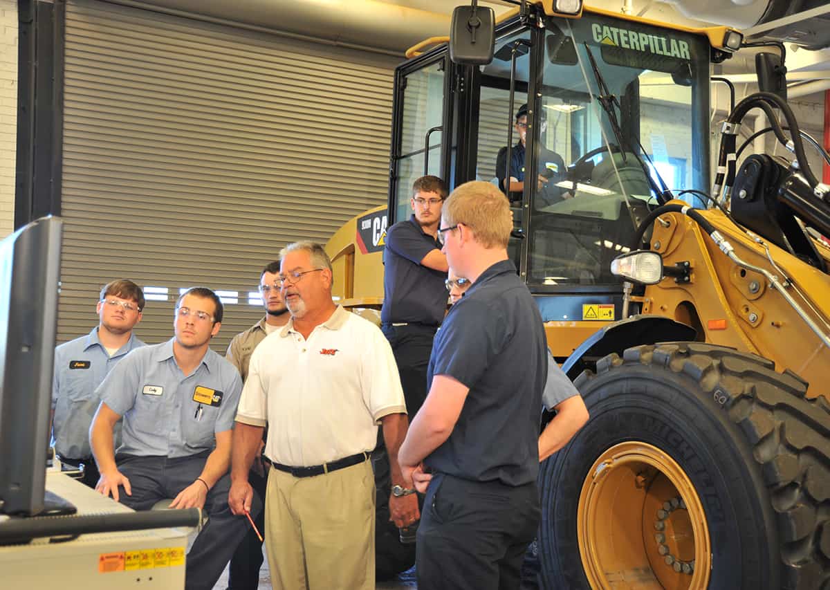Former SGTC Caterpillar Heavy Equipment Dealer's Service Technology Instructor Rick Davis is shown above teaching his CAT students.