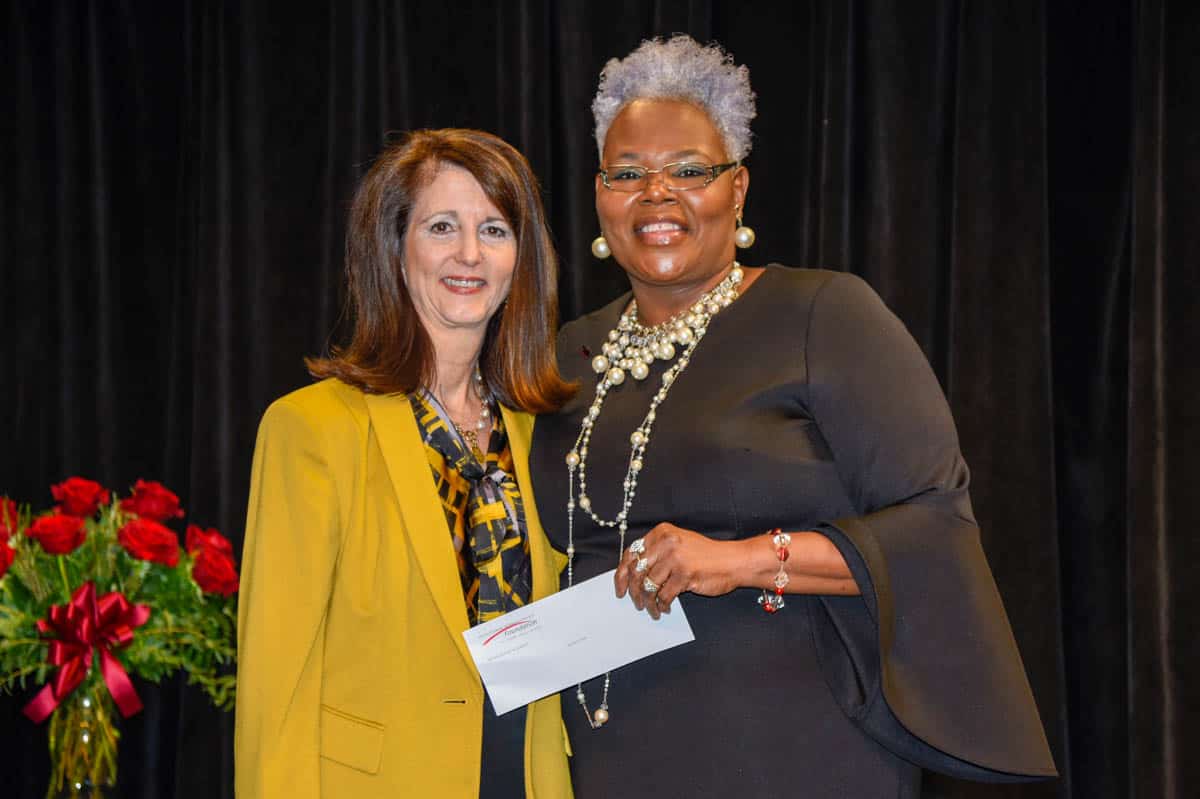 Synovus’ Tami Duke is shown above (left) presenting Dorothea Lusane McKenzie with a donation from Synovus for being selected as the South Georgia Technical College 2020 Instructor of the Year.