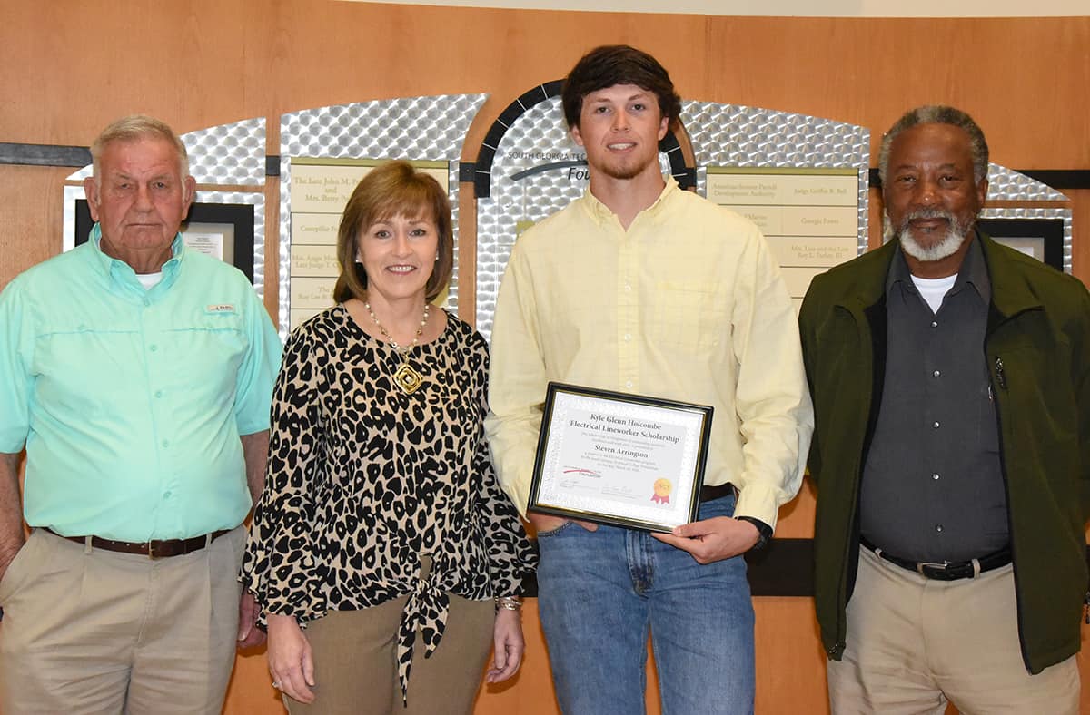 South Georgia Technical College Electrical Lineworker instructor Dewey Turner (l to r) is shown above with SGTC Economic Development Assistant Tami Blount, the Electrical Lineworker Kyle Glenn Holcombe Scholarship recipient Steven Arrington and SGTC Lineworker Instructor Sidney Johnson.