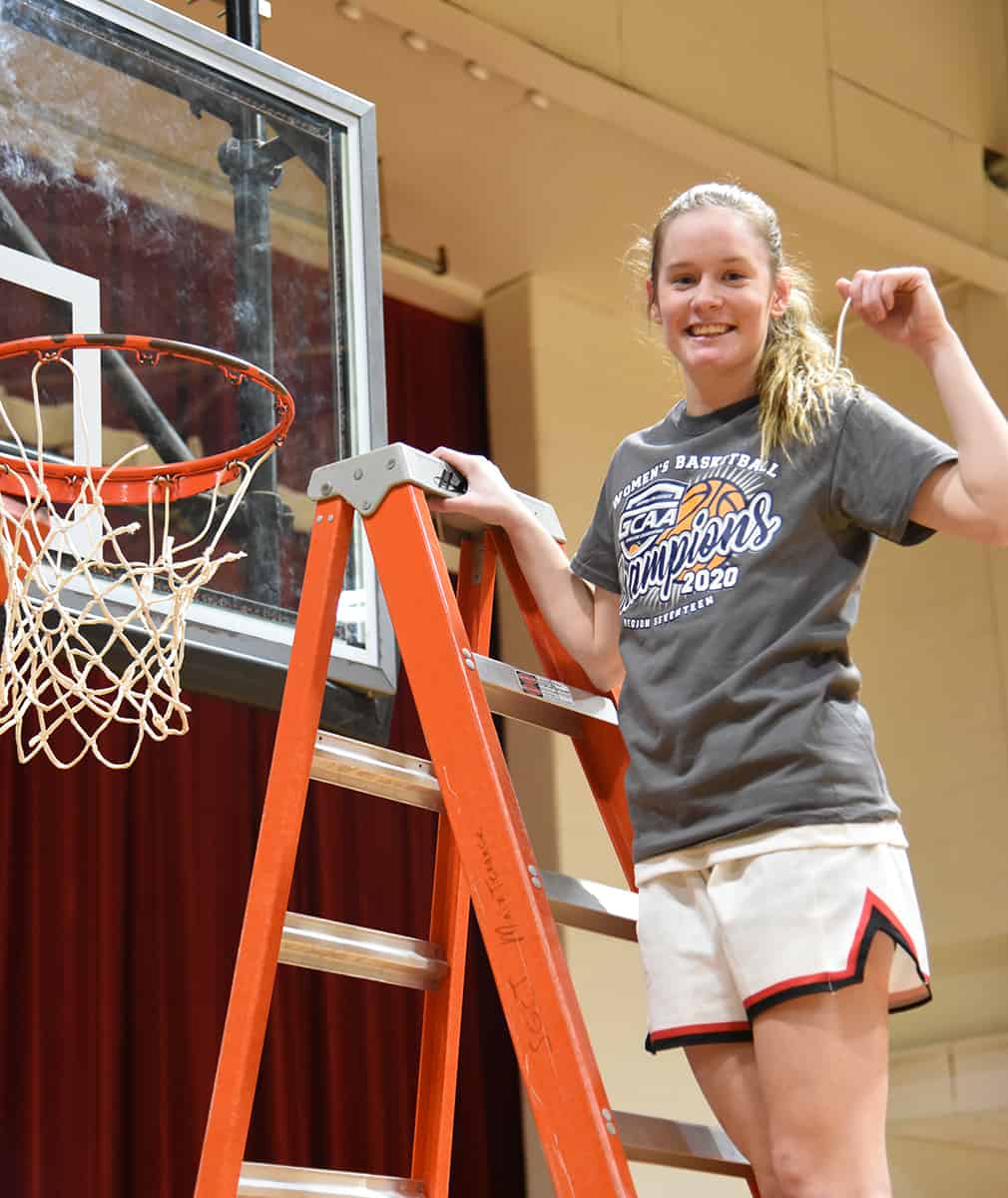 Anna McKendree is shown above cutting down the net after the SGTC Lady Jets won the NJCAA Region XVII championship.