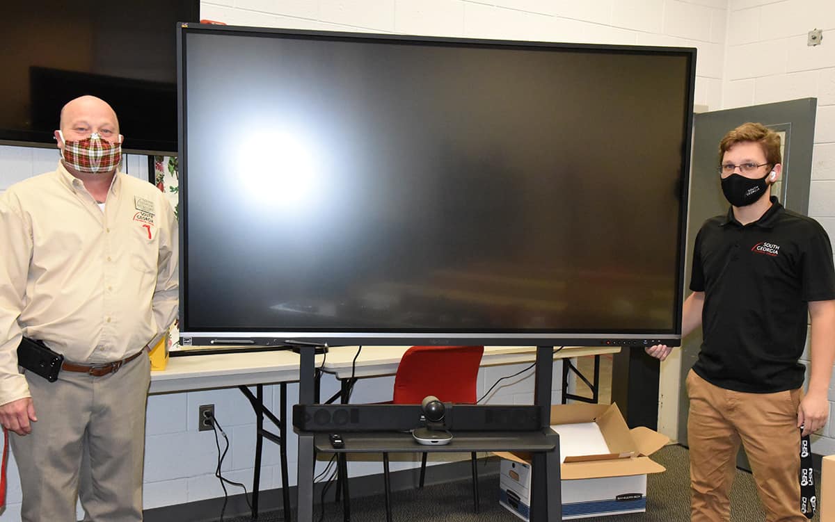 South Georgia Technical College’s Levi Cowan from the IT department is shown above (right) getting one of the new SMART Boards up and running for SGTC Culinary Arts Instructor Chef Ludwig “Ricky” Watzlowick to use in his Culinary Arts program instruction.