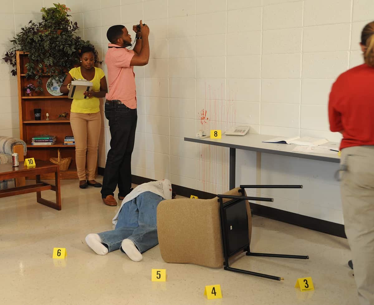 South Georgia Technical College Criminal Justice students shown above working a fake crime scene investigation.