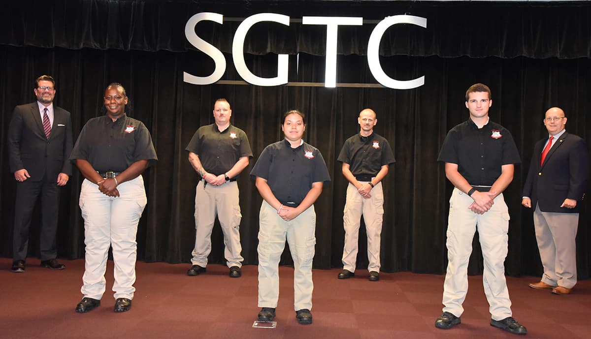 South Georgia Technical College President Dr. John Watford (back left) and LEA Academy Director Brett Murray (back right) are shown above with the members of the South Georgia Technical College Law Enforcement Academy Class 20-01 cadets who competed their training recently that was interrupted due to the COVID-19 pandemic. These five cadets earned their POST certification and a technical certificate of credit for their course work in the academy. Shown above on the front row are: Angela E. Sims of Plains; Yamilette Martinez-Rodriguez of Oglethorpe, and Grayson H. Watson of Sycamore, GA. On the back row with Dr. Watford and Brett Murray are William D. McClanahan and Edwin D. Harvey, III.