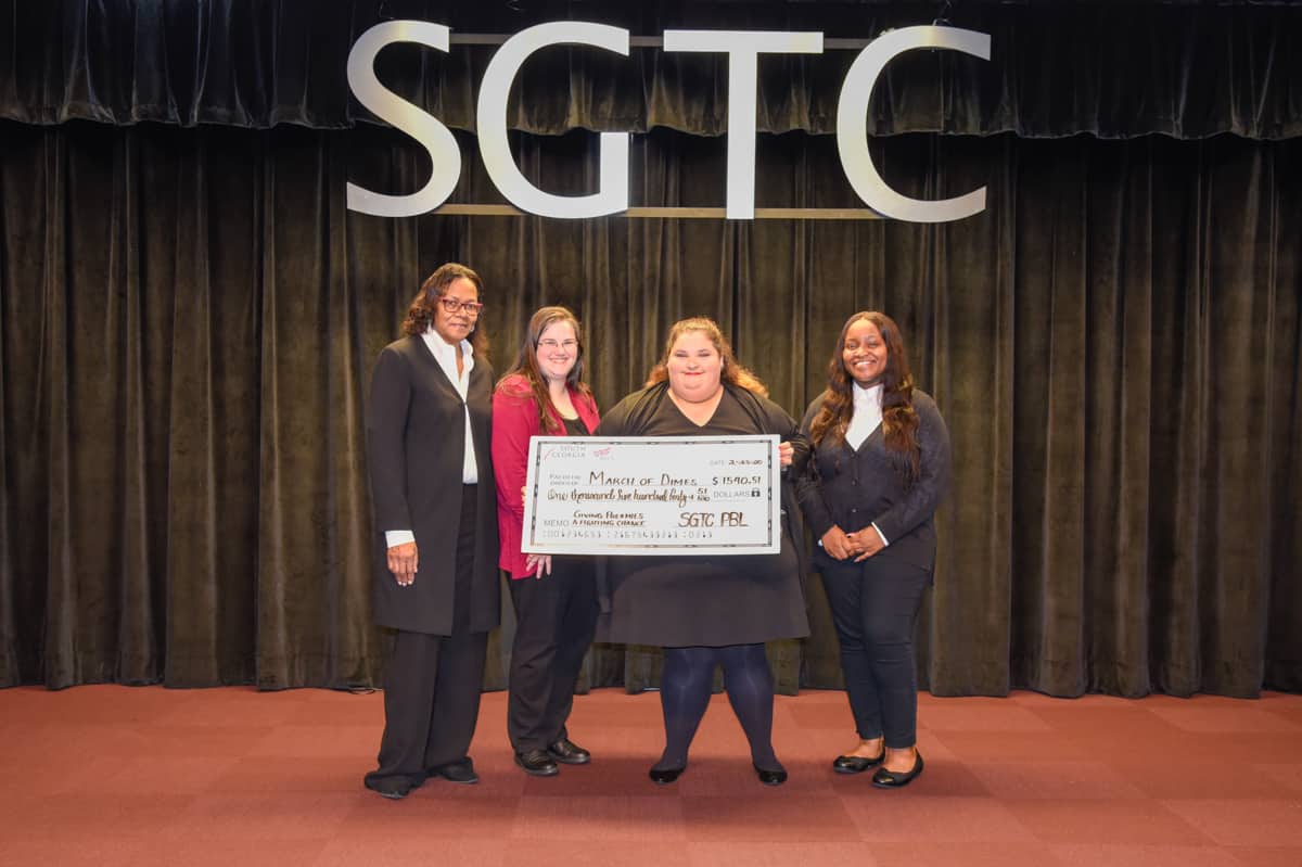 Pictured are (l-r) SGTC PBL’s Gwendolyn Coley, Heather Hinton, Ashley Halstead, and Kenyatta Slaughter with a check representing a contribution of over $1500 to March of Dimes.