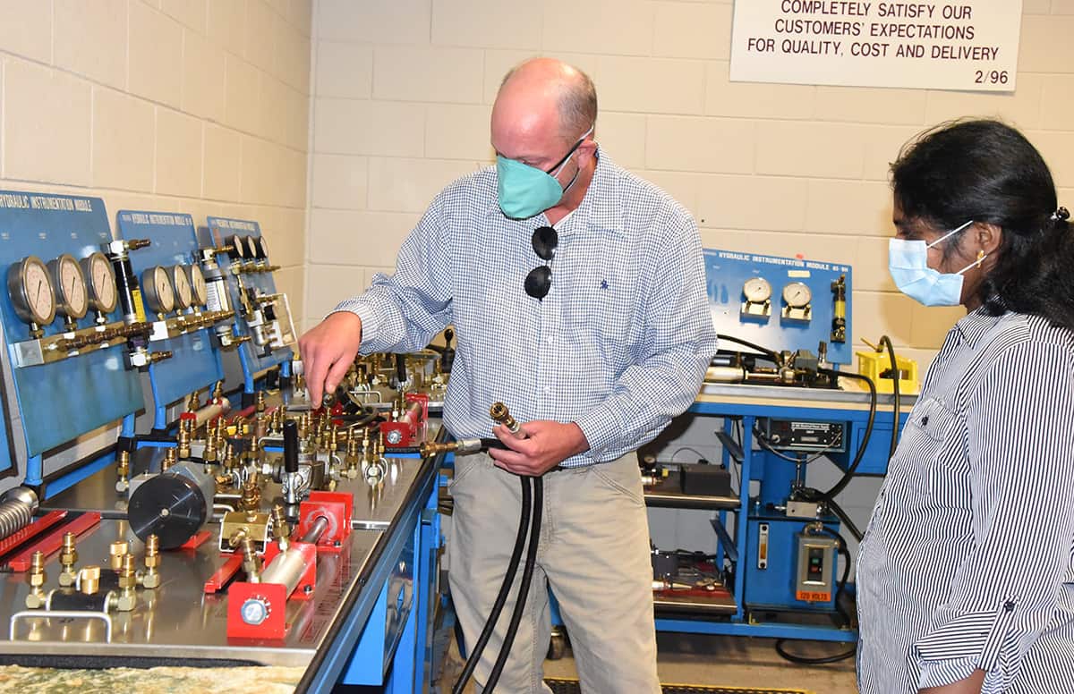 South Georgia Technical College Industrial Systems Technology Instructor Patrick Owen is shown above with Macon County High School Instructor Twinkle Mark looking at the hydraulics training system in his Industrial Systems Technology lab at South Georgia Technical College.