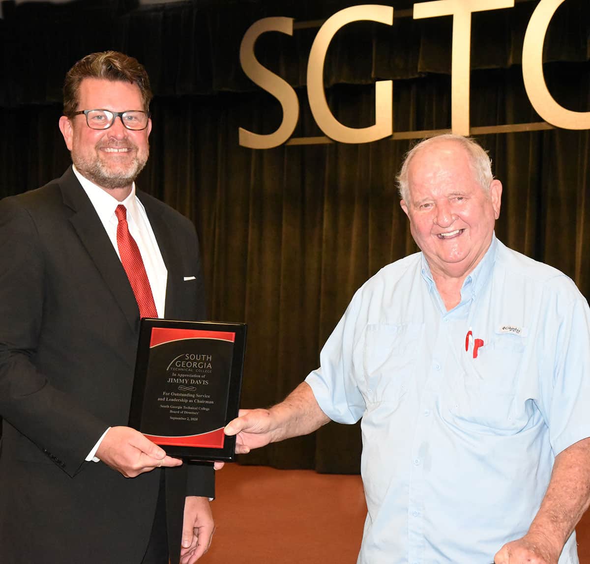 SGTC President Dr. John Watford (left) is shown above presenting the plaque to Jimmy Davis (right) in recognition of his service to the SGTC Board of Directors as Chairman for 2019 – 2020.