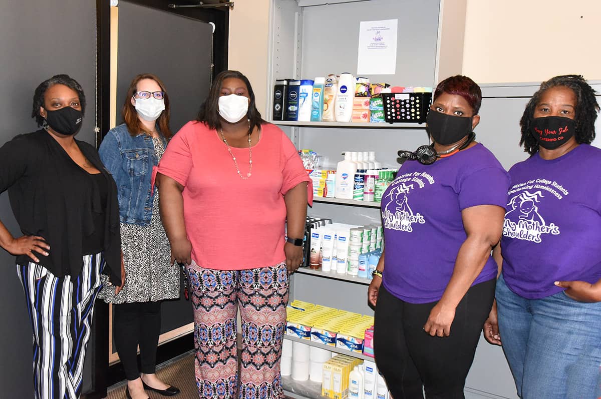South Georgia Technical College’s Jennifer Robinson, Audra Cook Ekkel and Eulish Kinchens are shown above with On My Mother’s Shoulders’ Claudia Phillips and Pamela Whitfield in front of some of the toiletries donated to the college for students in need in the Jets Pantry area.