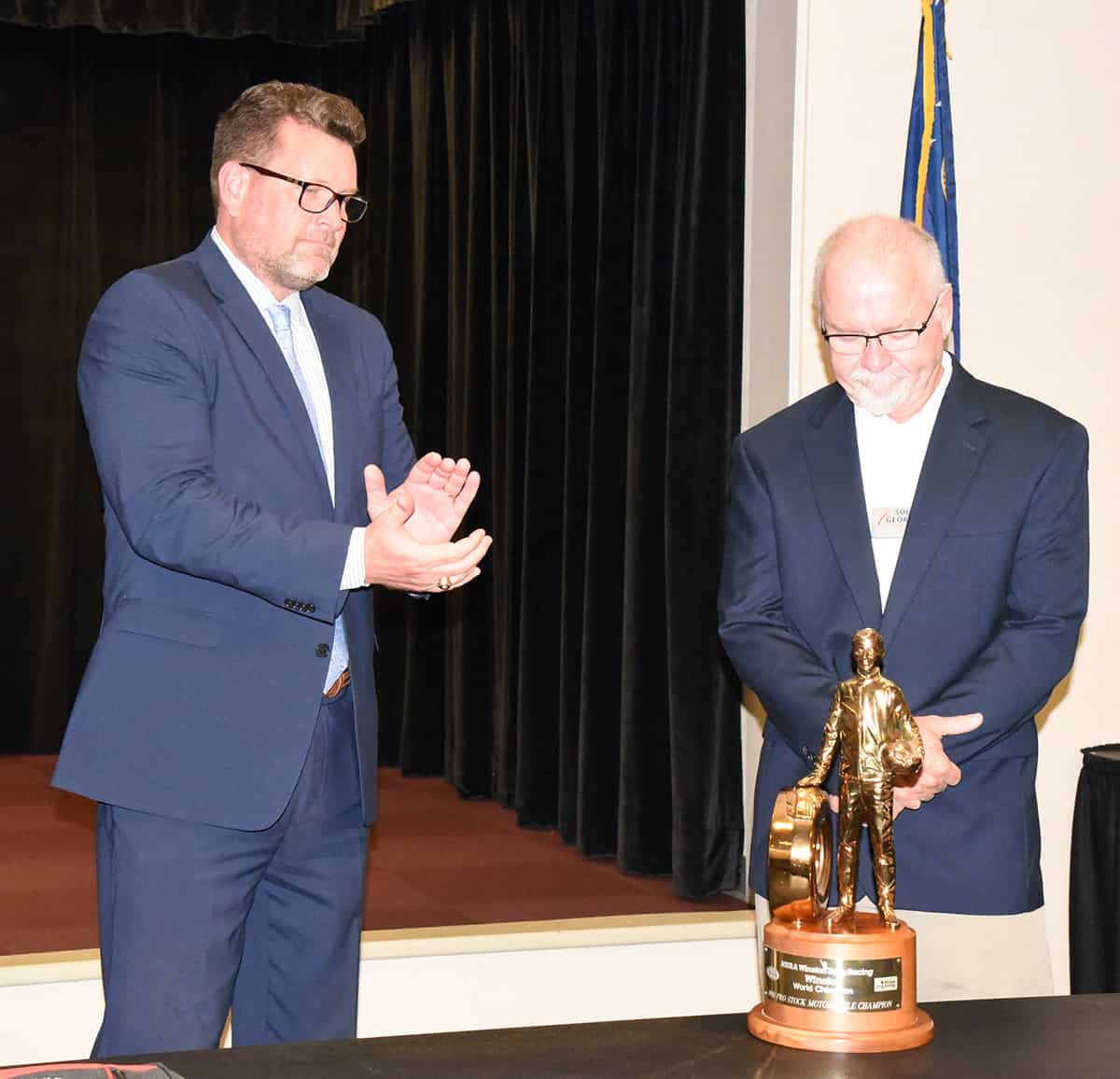 South Georgia Technical College President Dr. John Watford (l), is shown above thanking George Bryce (r) of Star Racing for his service to the South Georgia Technical College Board of Directors and for the gift of the National Championship ‘Wally’ trophy to the college as a symbol of partnership between Star Racing and the college.