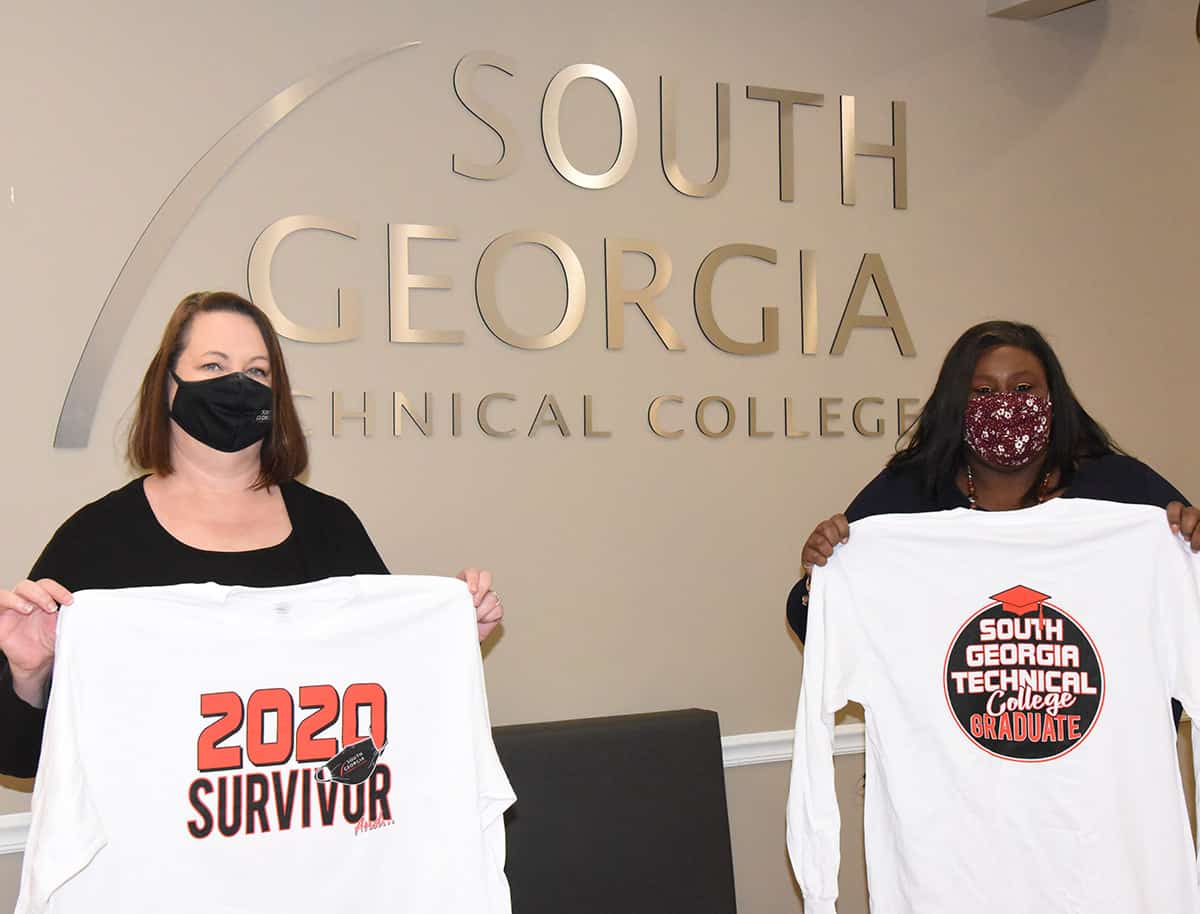 South Georgia Technical College Registrar Kari Bodrey is shown above displaying the front of the SGTC graduate shirt with the 2020 Survivor words and SGTC Vice President of Student Affairs Eulish Kinchens is shown showing off the back of the graduate shirt.