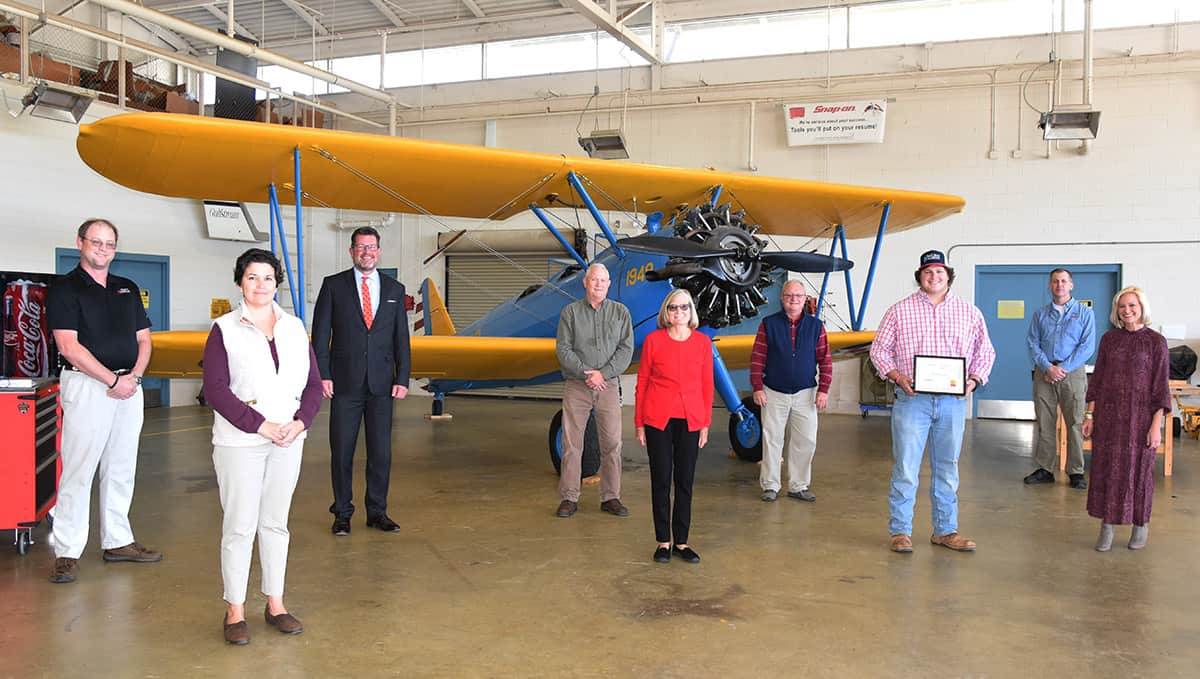 The first Mike Cochran Aviation Scholarship was awarded recently to SGTC Aviation Maintenance student Ragan Norman of Americus, (third from right). Shown above (l to r) is SGTC Aircraft Structural Technology Instructor Jason Wisham, Aviation Maintenance Instructor Victoria Herron, SGTC President Dr. John Watford, SGTC Aviation Maintenance Instructor David Grant, Nancy Cochran, Aviation Maintenance Instructor Charles Christmas, Ragan Norman, Aviation Maintenance Instructor Paul Pearson, and Kelly Cochran Bazemore, in front of the college’s bi-plane from 1948.