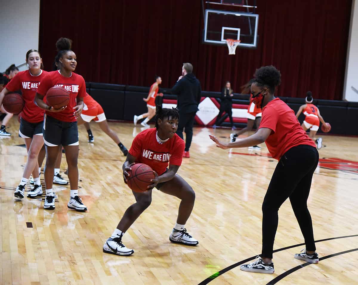 Veronica Charles, a 5’ 4” sophomore guard from Lagos, Nigeria, is shown above warming up getting ready for the pre-season scrimmage with Northwest Florida.